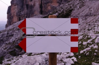 Blank direction signs in the mountains