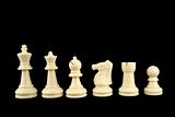 White Chess Pieces on Black Background