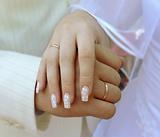 Brinde and groom hands with rings