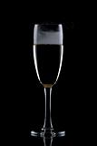 Glass of wine isolated over black background