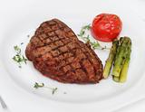 Beef steak with cooked asparagus