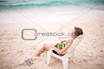 Pensive woman on the beach