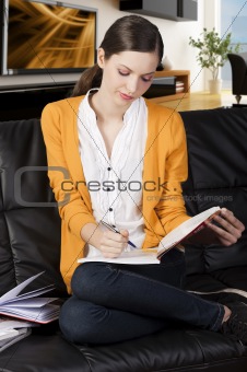 the girl reading a book with absorbed axpression