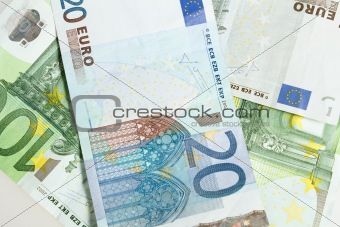 Euro banknotes arranged in background