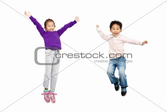 happy boy and girl jumping together