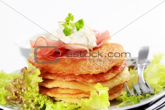 Small potato pancakes with salad
