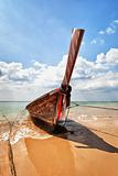 Wooden traditional boat on the beach - Thailand