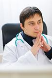 Portrait of thoughtful medical doctor