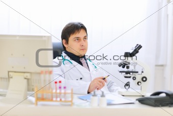 Thoughtful medical doctor at office