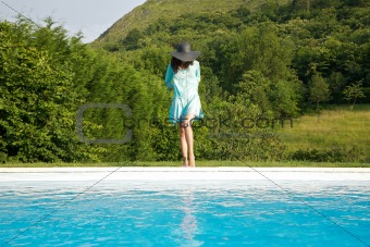 blue dress woman on pool border