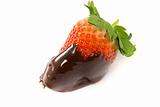 Lonely strawberry dipped in melted chocolate