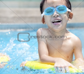 happy asian kid in Swimming Pool