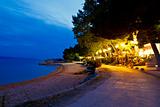 Beach Restaurant near the Sea at Night in Brela, Croatia