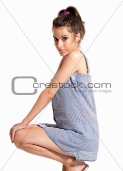young female wearing pajamas happy crouched isolated on white background