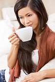 Beautiful Chinese Oriental Asian Woman Drinking Tea or Coffee