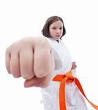 Karate girl with her fist in foreground