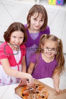 Young girls having pizza