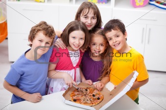 Kids at home with pizza