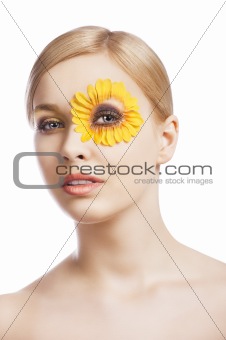 the floral makeup, she looks down, she looks in to the lens