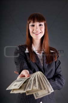 Cheerful business woman with dollars 