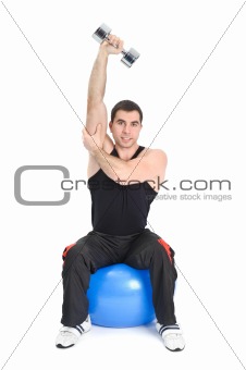 Young man doing Seated Dumbbell One Arm Triceps Extensions on Fitnes Ball, phase 2 of 2.