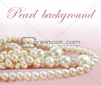 Background with Pearls  necklace on  pink silk fabric