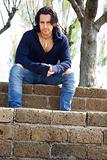 Muscular male model on stairs with sweat shirt
