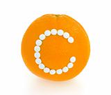 Orange with vitamin c pills over white background - concept