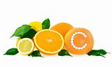 Orange, lemon, grapefruit with vitamin c pills over white background