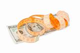 dollar banknote and measurement tape