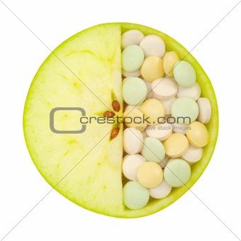Close up of apple and pills isolated - vitamin concept