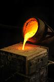 Foundry - molten metal poured from ladle into mould - lost wax casting