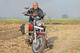 Rural Landcape with senior citizen on a motorcycle