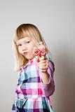 Little girl with lollipops