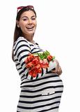Happy pregnant woman with tulips