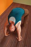 Woman In Urdhva Dhanurasana Yoga Pose