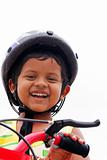 Young indian boy with helmet expressing happiness