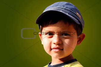Photo of handsome indian boy with a cap smiling