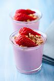 Bilberry yogurt with granola and strawberries
