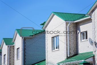 Facades of modern brick townhouses