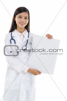 Female doctor showing blank board