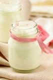 fresh natural yoghurt in glass jar