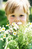 Little girl with daisies