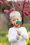 toddler with lollipop