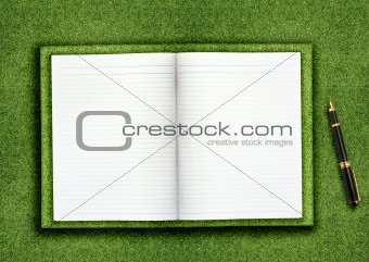Blank book on grass