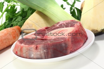 raw leg slice with soup vegetables