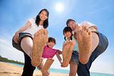 happy asian family enjoy summer time on the beach