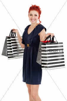 Happy shopper showing her bags 
