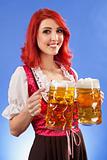 Beautiful woman serving beer at Oktoberfest