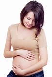 pregnant woman touching her belly with her hands